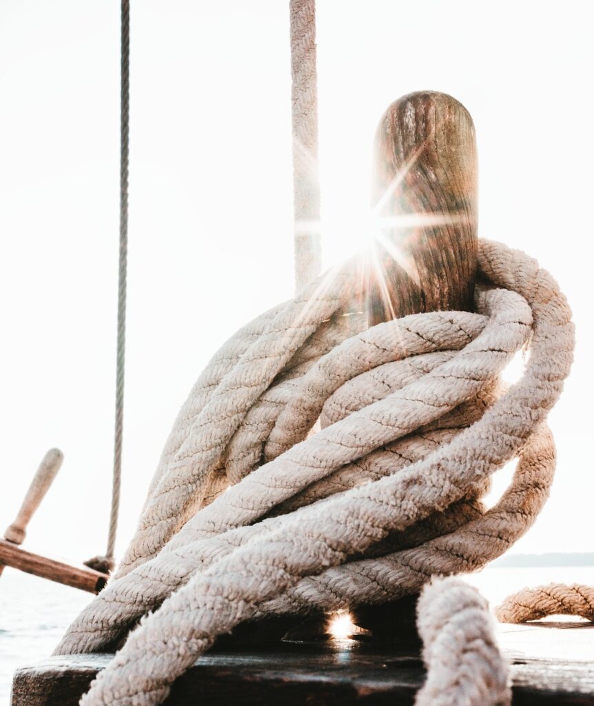 sn-man-jumping sailing vessel, ropes, ship, boat, sailing boat, rigging, sail, leash, close up, ship accessories, background, beautiful wallpaper, iphone wallpaper